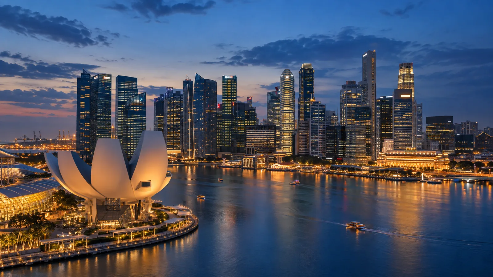 A modern international city illuminated at blue hour